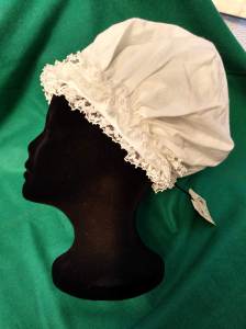 A large caul is gathered into a non-adjustable headband.
