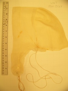 18th C woman's cap: lappet with ruffle gathered only at the tips. Long strings gather the nape. 